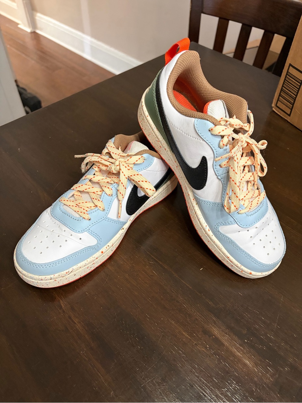 Nike Low-Top Sneakers in Light Blue, White & Black with Orange Accents
